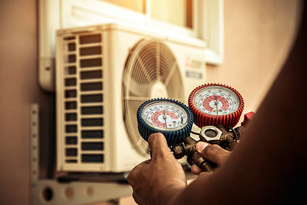 Professional Air Conditioning Service technician working in Mogadore, OH